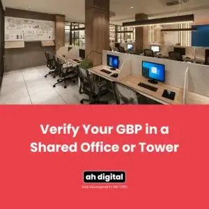 Modern shared office with computers, desks, chairs, and a whiteboard above a red banner reading “Verify Your GBP in a Shared Office or Tower.”